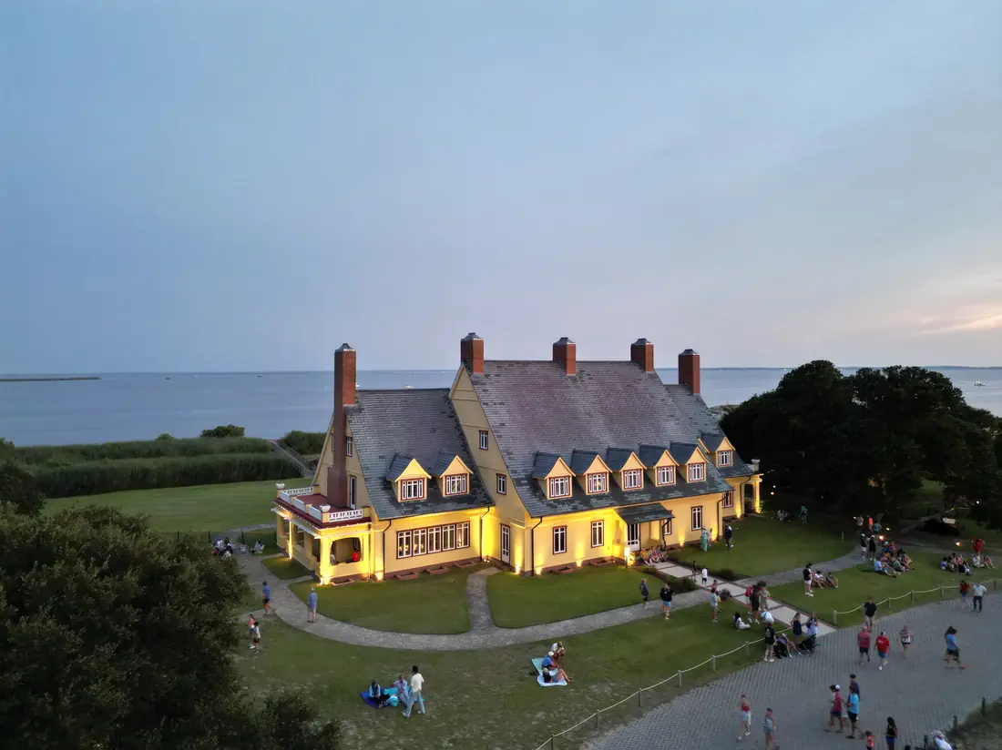 Historic mansion and grounds at dusk from above