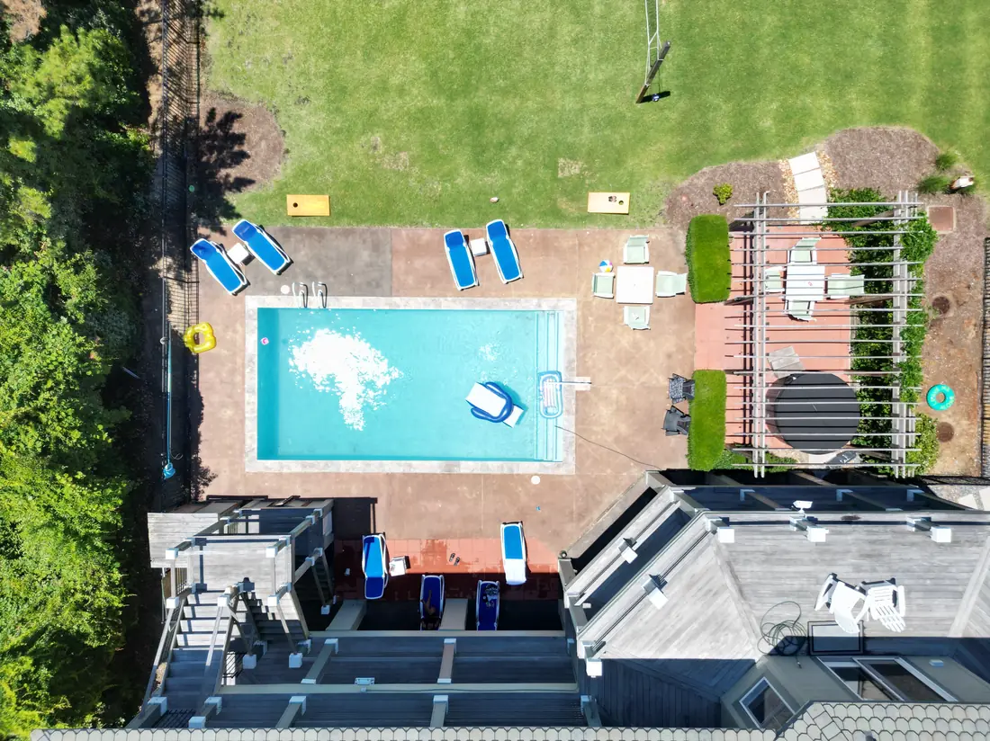 Direct overhead aerial of a pool and patio